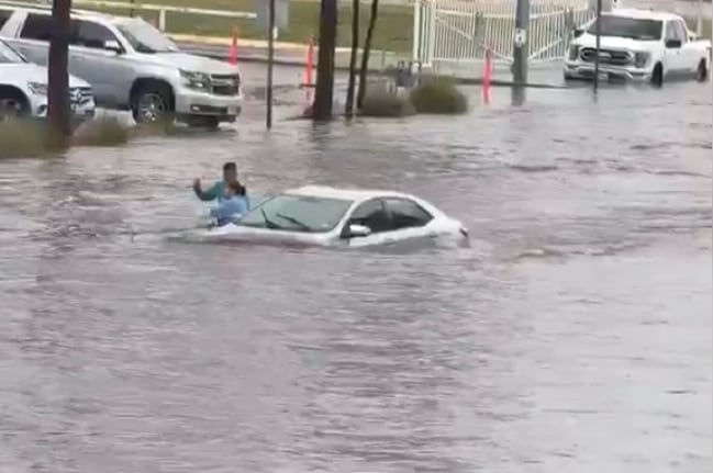 Two Men Rescue Woman Trapped in Car on Flooded Midland Street