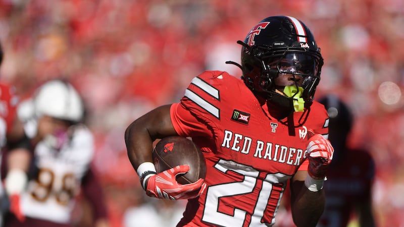 Texas Tech running back J'koby Williams (20) runs for a touchdown during the first half of an...