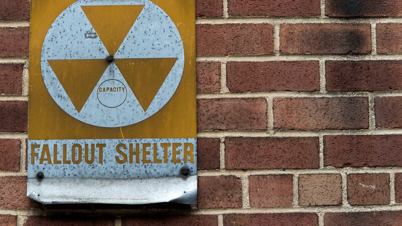 A fallout shelter sign hangs on a building on East 9th Street in New York, Jan. 16, 2018....
